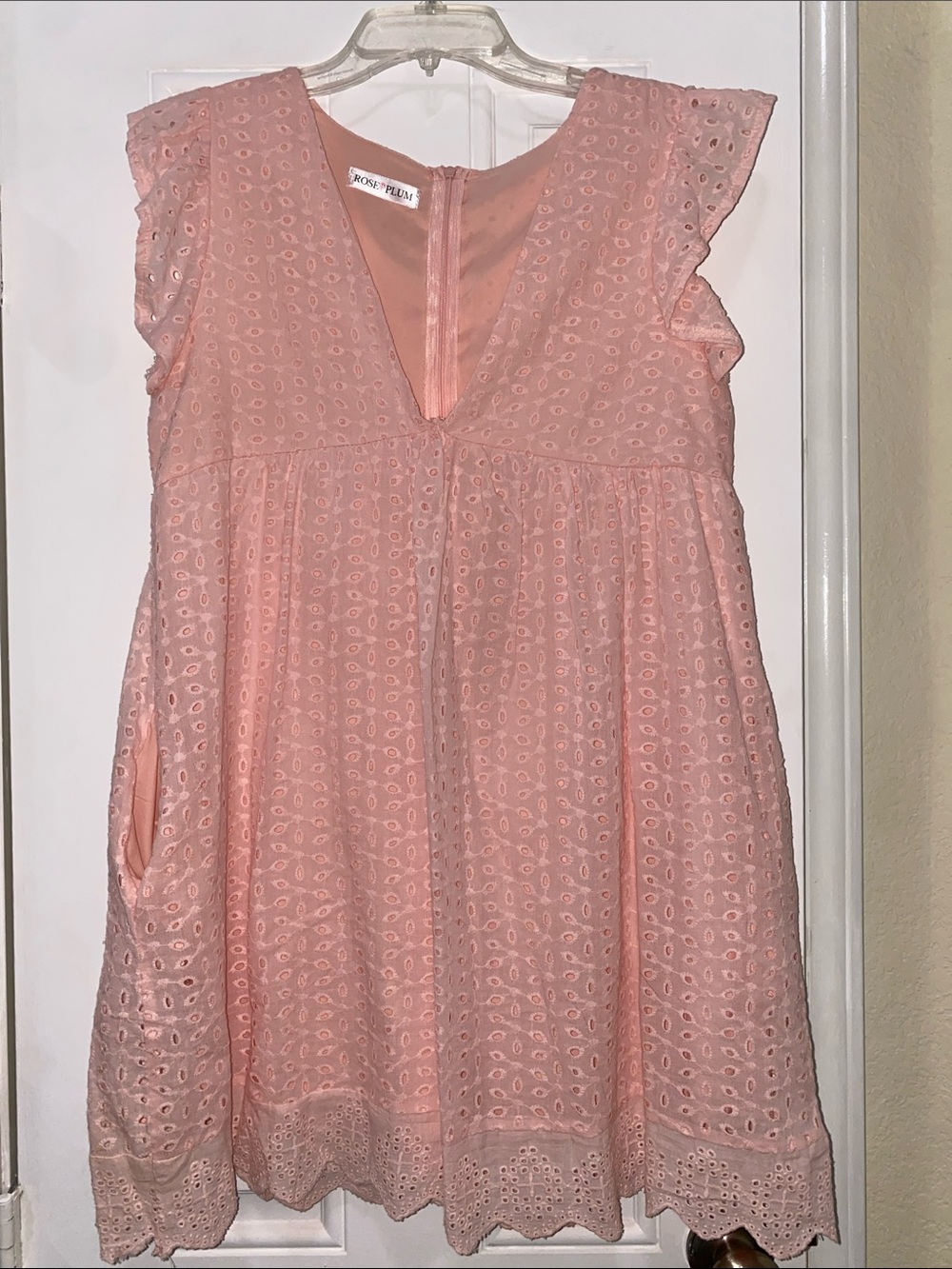 Blush Pink Eyelet Flutter-Sleeve Dress. Pockets and built in shorts